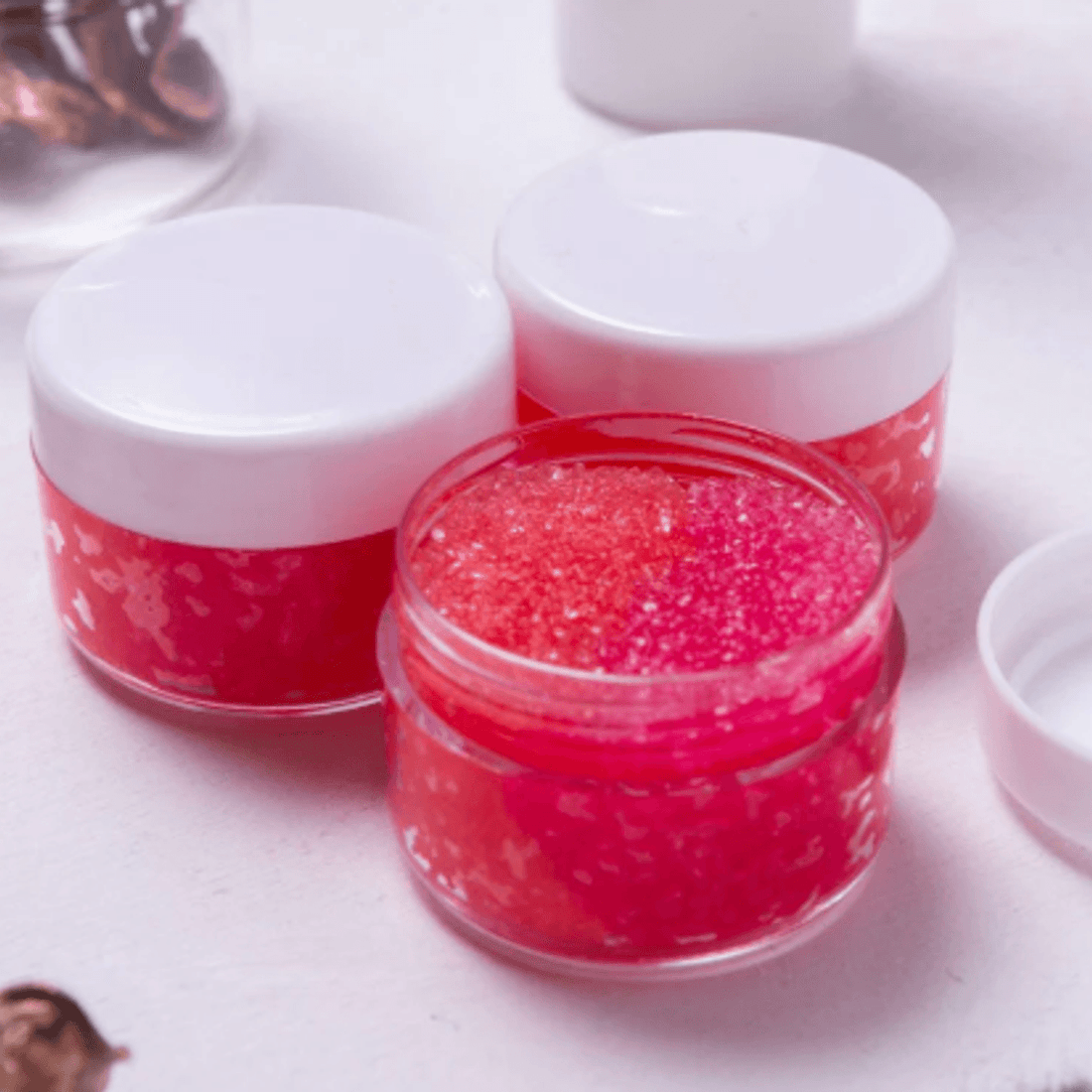Lip Therapy Scrub jars showing pink glitter scrub texture