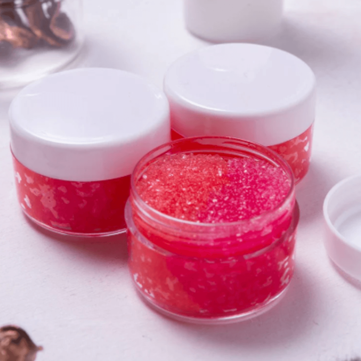 Lip Therapy Scrub jars showing pink glitter scrub texture