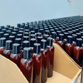 Full body glow kit bottles in bulk — amber bottles ready for dispatch