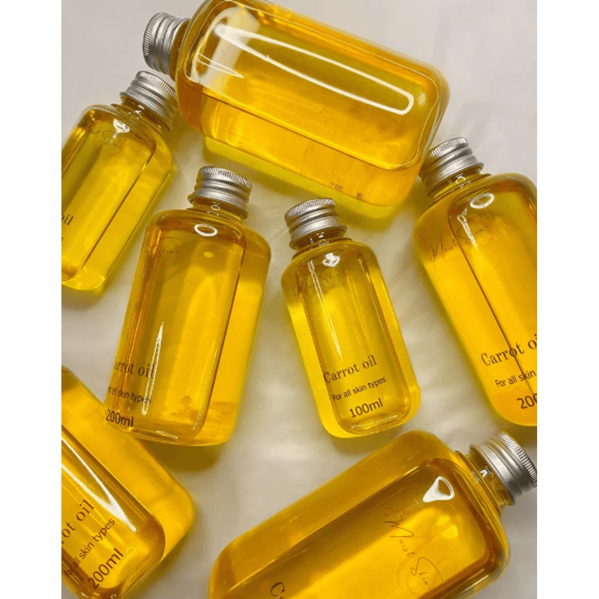 Carrot oil bottles — 100ml and 200ml sizes