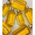 Carrot Pure Glow Oil bottles — 100ml and 200ml sizes in golden yellow