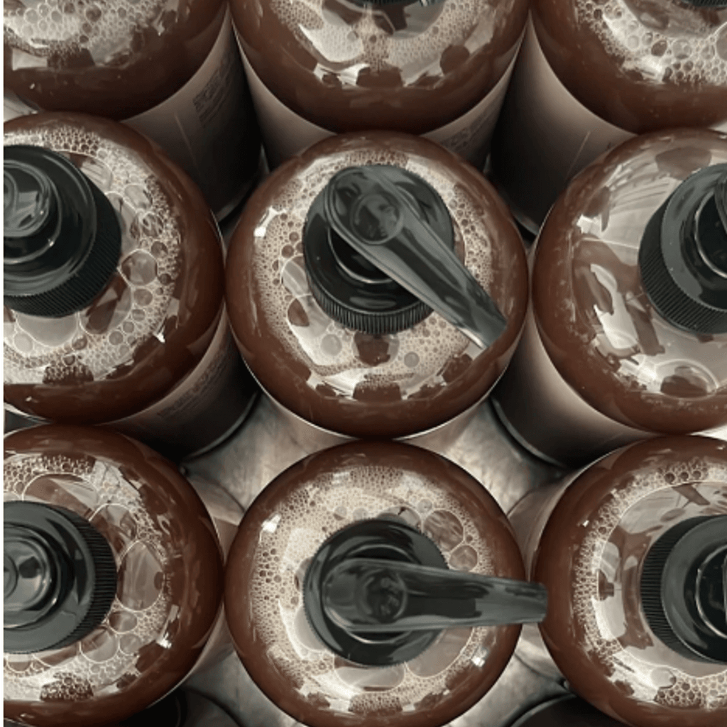 Lightening black soap bottles from the Full Body Brightening Package