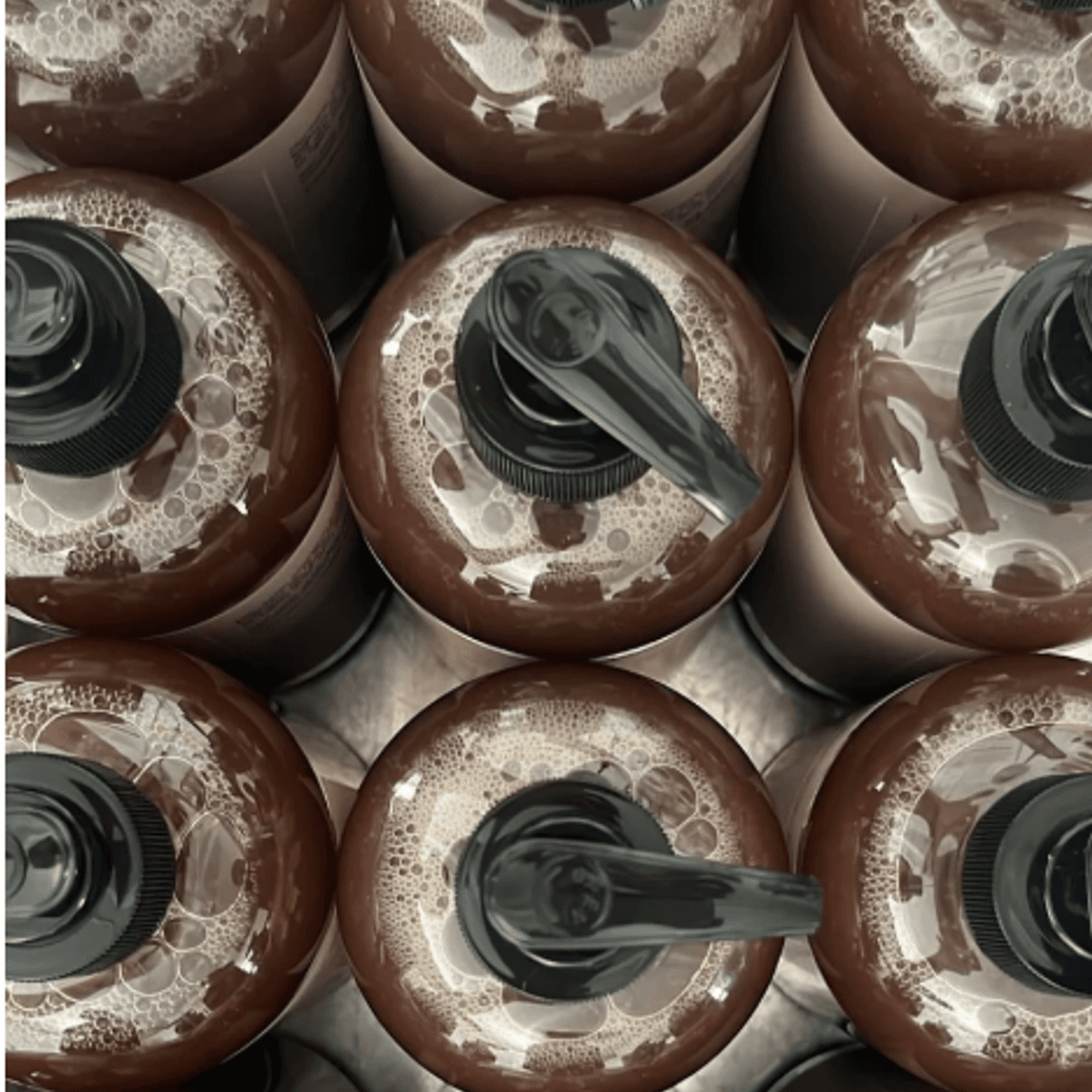 Lightening black soap bottles from the Full Body Brightening Package